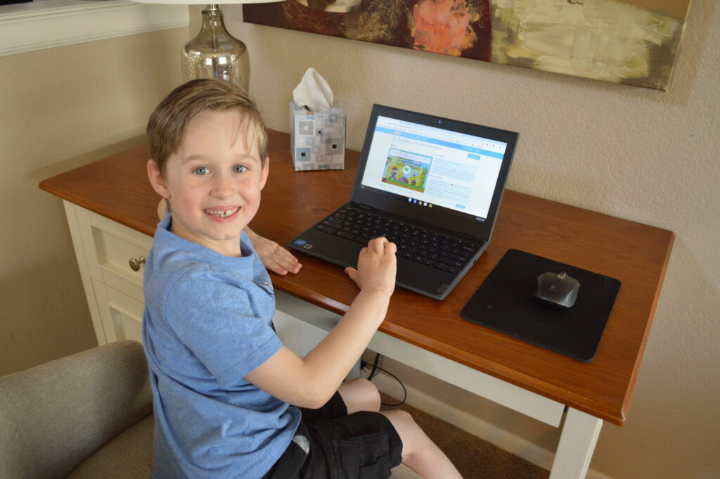 kids learning to code on a Chrome book