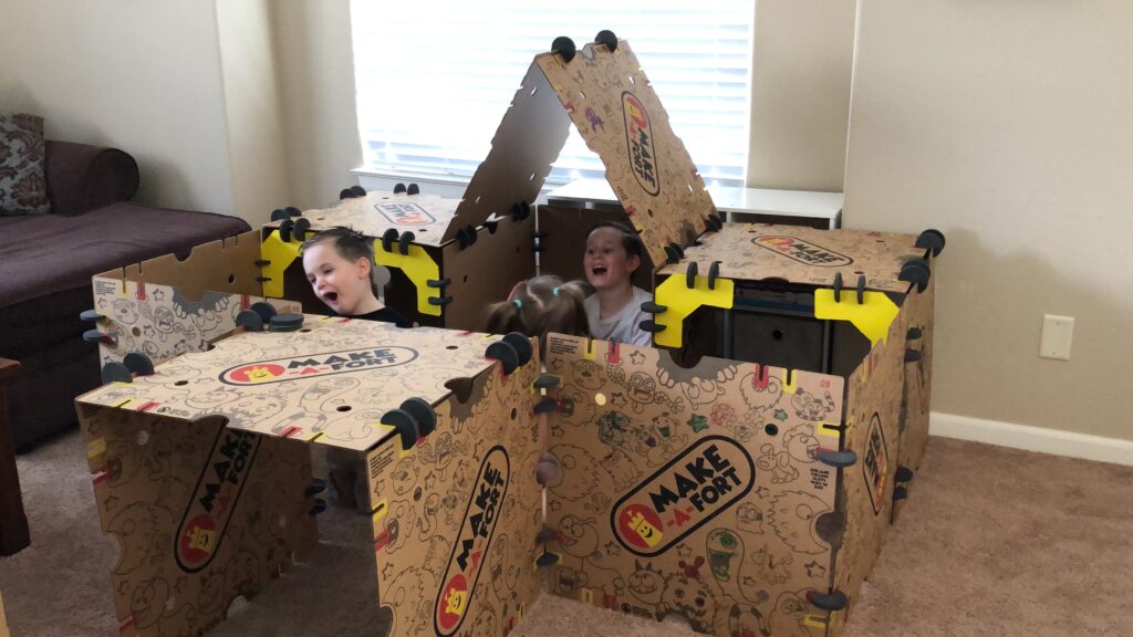 Kids playing together in a fort