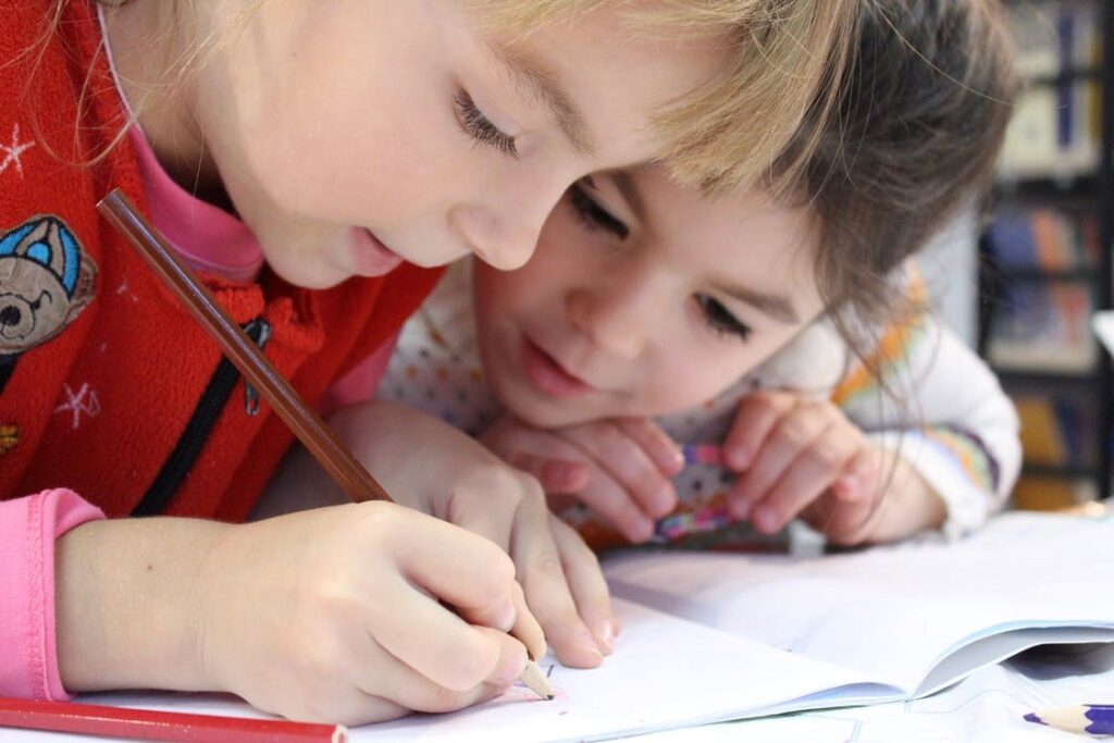 Girl writing on notebook