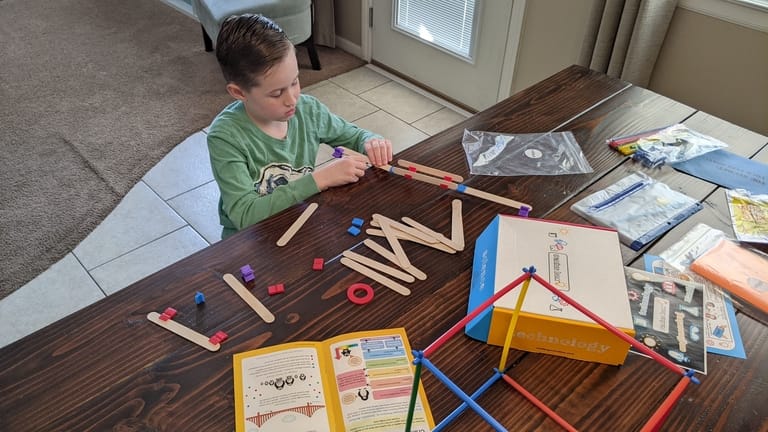Kids building with sticks