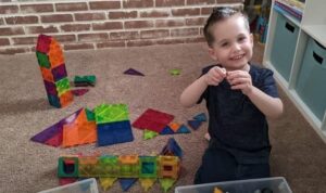 Toddler Playing with Magna Tiles
