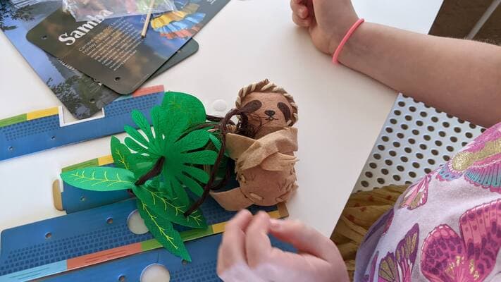 my daughter putting the stuffed animal together