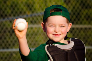 Boy playing baseball.