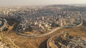 Israel and Palestine divided by Security wall Aerial view Aerial view of Left side Anata Palestinian town and Israeli neighbourhood Pisgat zeev.