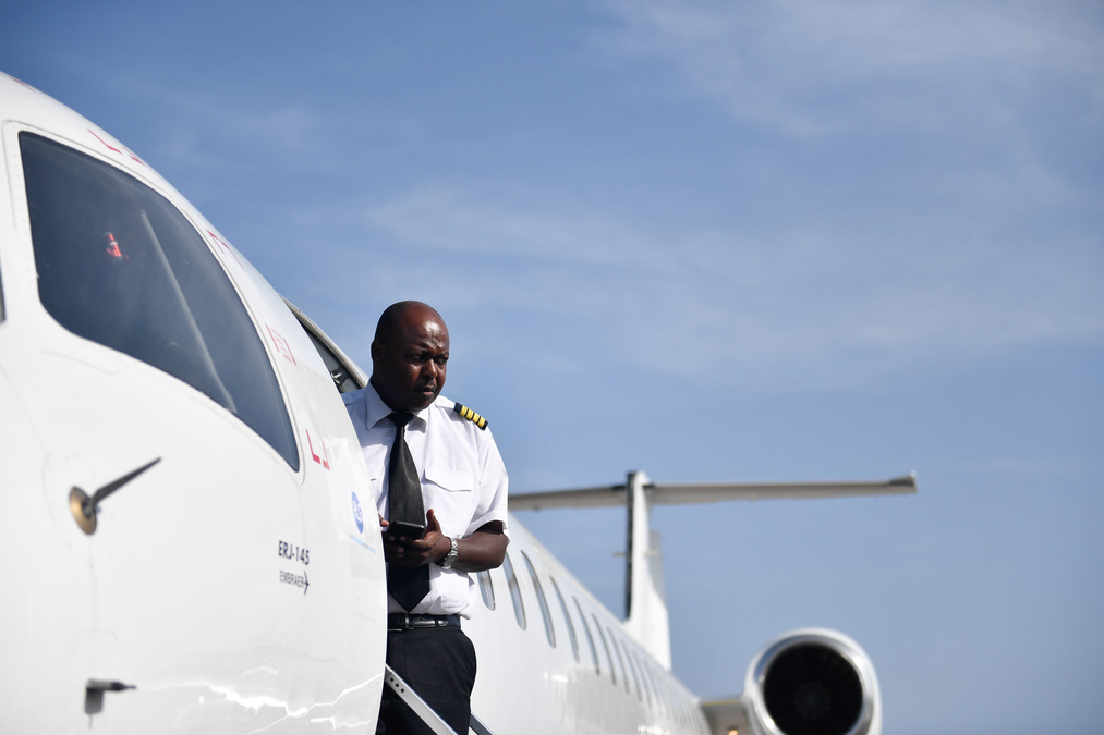 pilot getting out of airplane.