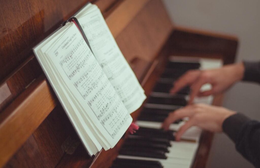 playing piano with piano piece.